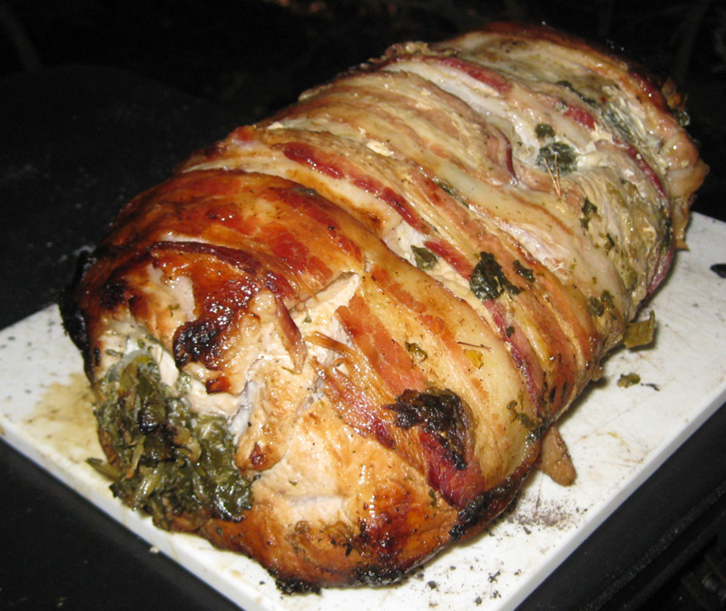 Bacon-wrapped pork loin stuffed with collards